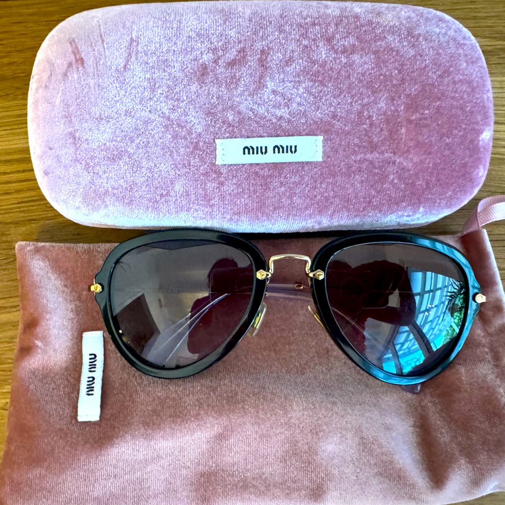 Miu miu black and gold frame sunglasses
